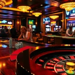 KJC casino ambiance featuring exciting players around a roulette table with poker chips and cards.