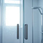 View of elegant shower doors with intricate details, enhancing modern bathroom aesthetics.