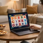 Person playing Mahjong Ways slot on a laptop during a cozy home gaming session