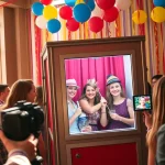 Engaging guests using the photo booth Chicago at a lively event with colorful props.