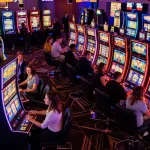 Engaging players experiencing slot gacor gampang menang at a lively casino floor filled with colorful machines.
