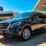 Efficient Private Airport Transfers with a luxury vehicle at the airport terminal.