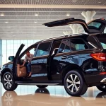 Experience seamless Private Airport Transfers with a luxurious SUV ready for passengers at the terminal.